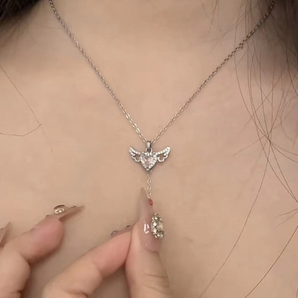 Moving cupid heart necklace with angel wings