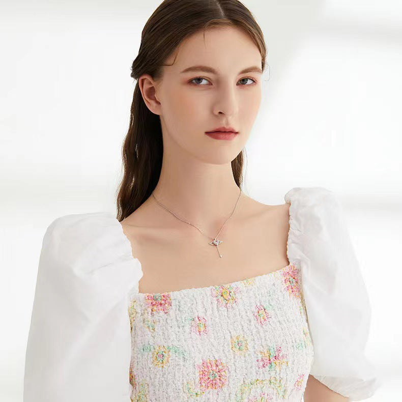 Moving cupid heart necklace with angel wings